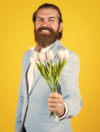 Take it. happy fathers day. mature bride groom with bouquet. hipster man hold tulip flowers. gift...