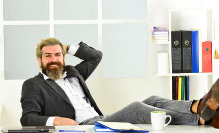 Working day. CEO has to be moral leader of company. Man bearded boss sit office. Manager solving...