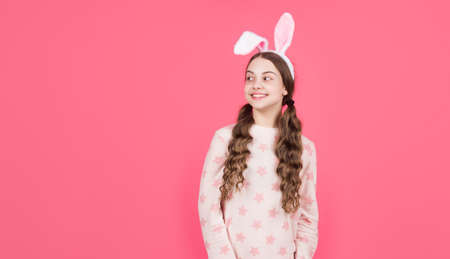 happy easter teen girl in bunny rabbit ears and pajamas, copy space, easterの写真素材