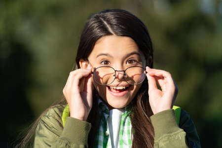 amazed kid with backpack wear glasses. back to schoolの写真素材