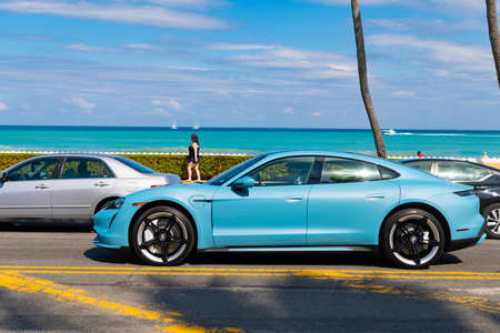Palm Beach, Florida USA - March 21, 2021: porsche car on road in palm beach in the U.S. side view