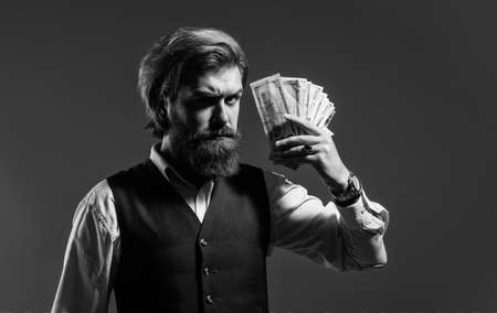 Rich man hold money cash financial success, investment in future conceptの写真素材