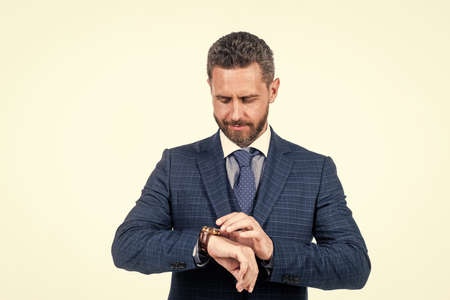 confident male boss watch time. business office life. time management.の写真素材