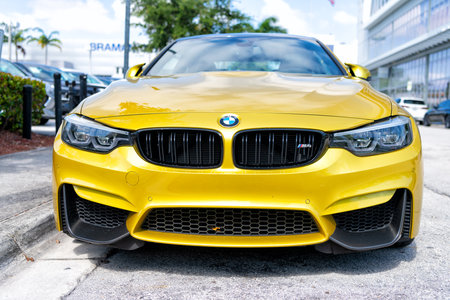 Miami Beach, Florida USA - April 15, 2021: yellow bmw m4, front view low angle. luxury sportcarのeditorial素材