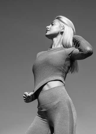 woman fitness trainer with sexy tight buttocks in stylish sportswear, fitnessの写真素材