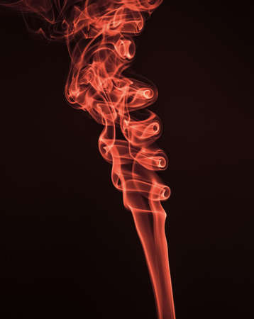 Wisp of red smoke spiraled abstract steaming maroon background, steamの写真素材