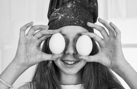 teen girl in cook uniform prepare food in kitchen, culinaryの写真素材