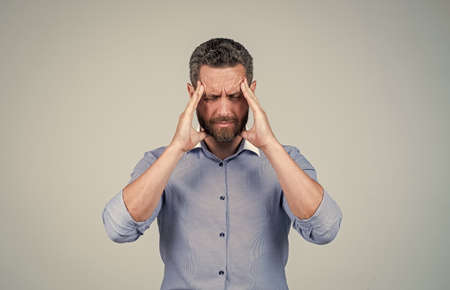 Headache attack. Businessman suffer from headache. Suffering from migraine pain. Head ache