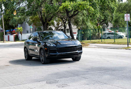 Miami Beach, Florida USA - April 15, 2021: black Porsche Cayenne, corner view. sports crossover carのeditorial素材