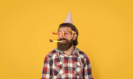 just having fun. happy birthday to you. male holiday celebration. bearded guy with party accessory....