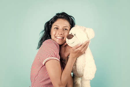 happy girl with bear toy present. holiday shopping sales. valentines day concept. best gift ever. gift of love. woman feel happy about present. love playing with fluffy toys. Love is a great feelingの写真素材