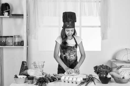 girl the future chef is cooking food, healthy eating