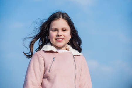 child with happy face on sky backgroundの写真素材