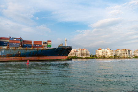 Miami Beach, Florida USA - April 18, 2021: cargo ship with containers in port. international...