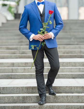 cropped view of man bridegroom in tuxedo. bridegroom wearing tuxedo bowtie outdoor. bridegroomの写真素材
