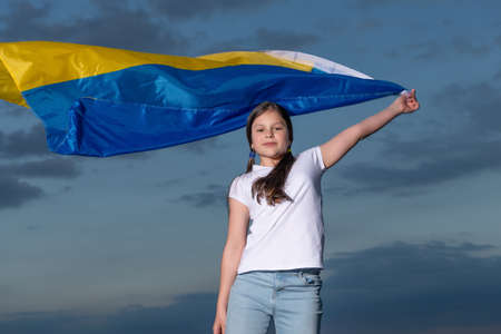 teen girl in ukraine. child with flag of ukraine. kid with ukraine flag feel freedom