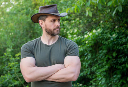 unshaven man wearing cowboy hat. caucasian man in hat. macho manの写真素材