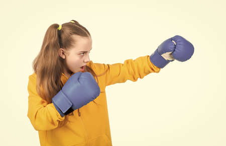 angry attack. child boxer isolated on white background. sport success. active and healthy childhood.の写真素材