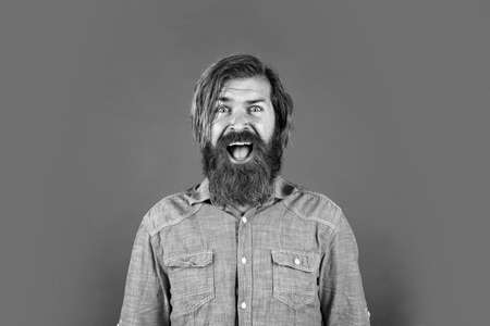 amazed bearded brutal man with moustache, human emotionsの写真素材