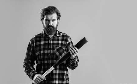 brutal man with baseball bat express aggression or play game, equipment