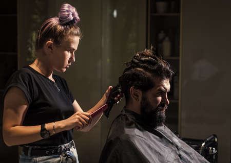 barber master cut hair. mature hipster with beard at hairdresser. hipster with moustache make new hairstyle. barbershop. male trendy hairdo. perfect haircut with blade razor. Enjoying morning routineの写真素材