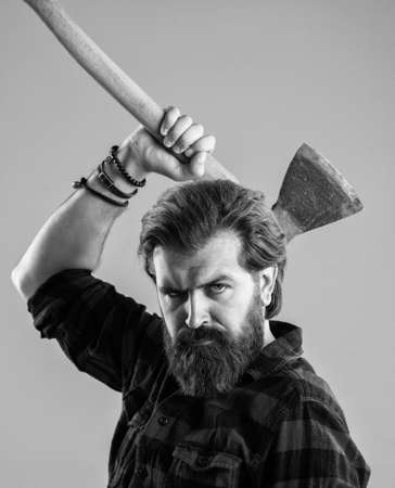 bearded male hipster in checkered shirt hold ax, campingの写真素材