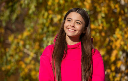 face of happy teen child outdoor in autumn season