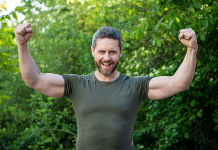 successful winning man. winning guy with happy face. man outdoor with winning gestureの写真素材