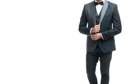 man bridegroom in rich tux bow isolated on white background. full lentgh