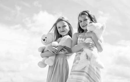 cute kids in dress hold teddy bear toy, childhoodの写真素材