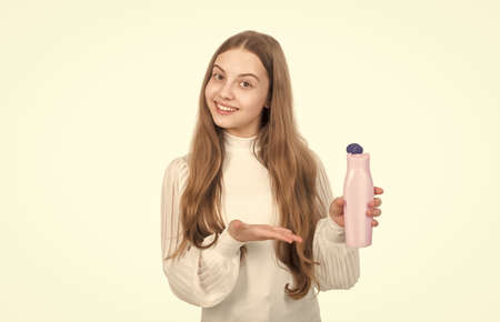 small beauty. wash and rinse. daily habits and personal care. girl has long beautiful hair.の写真素材