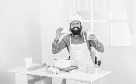Eat better. male chef in hat prepare healthy meal. handsome man with beard and moustache cooking food. professional restaurant cook baking. skilled baker use kitchen utensils for cookingの写真素材