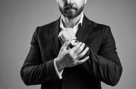 ceo man in jacket with groomed beard hair show hand watch, accessoryの写真素材