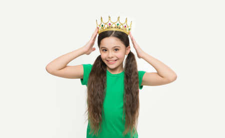 Kid wear golden crown symbol of princess. Girl dreaming become princess. Lady cute little princess. Royal concept. Child development and upbringing. Privilege elite school. Every woman is princessの写真素材