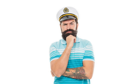Thoughtful man wearing captain hat. Bearded man thinking isolated on white. Man sailor with beard and moustacheの写真素材