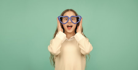 childhood happiness. fancy party look. happy funny kid in glamour eyeglasses