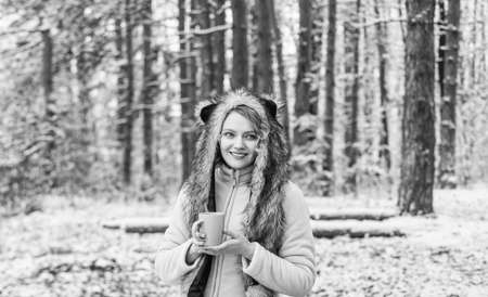 Animal care. Winter themed portrait cosy outfit. Woman wear wolf hat. Animal rights. Wild life...