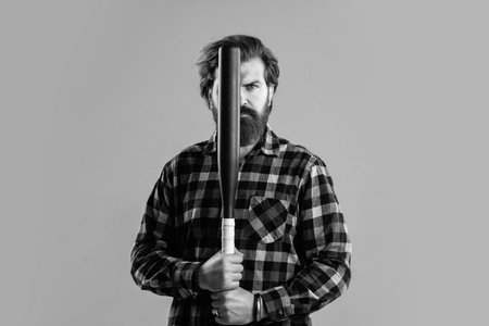 bearded male hipster in checkered shirt hold sport bat, fighter