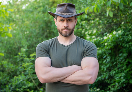 caucasian man wearing cowboy hat. caucasian man in hat. macho manの写真素材