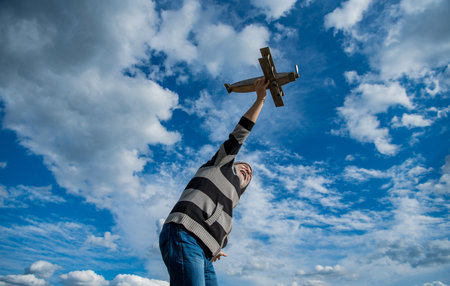 retirement of senior man on sky background. senior man at retirement. senior man with toy plane