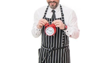 Barista man crop view. Barista holding clock. Barista hours. Coffeehouse cafe hoursの写真素材