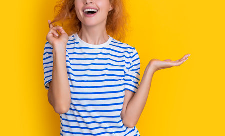 cropped view of redhead woman isolated on yellow background. of young redhead woman in studio