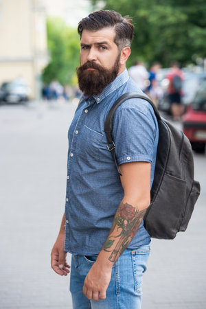 bearded man with backpack. man with beard. brutal man outdoorの写真素材