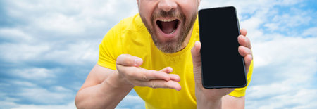 cropped view of man presenting smartphone screen with copy space