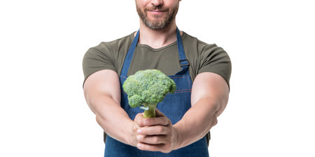 cropped view of man in apron with vegetable isolated on white. selective focusの写真素材