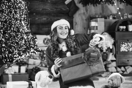 Fashion shop. Celebrate holiday. Buy makeup beauty supplies. Gift box. Special offer. Girl near christmas tree. Christmas tradition. Woman enjoy christmas. Pretty girl ready to celebrate christmasの写真素材