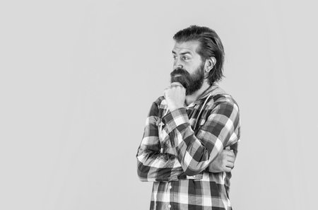 let me think. well groomed hairstyle. male beauty and fashion look. hipster checkered shirt for bearded guy. unshaven brutal man with beard. hairdresser concept. mature and confidentの写真素材