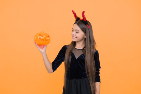 look what i have. cheerful kid hold creepy pumpkin. carnival costume party. trick or treat....