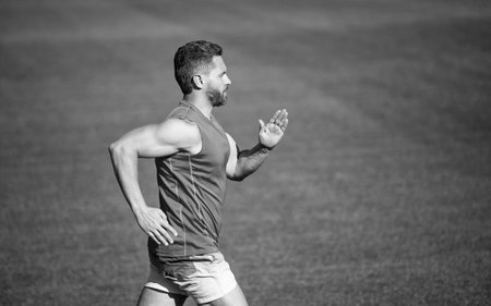 stamina. sport and endurance. outdoor stadium sprint. physical training. athletic guy run.の写真素材