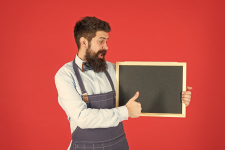 We are hiring. Happy barber show thumbs up holding hiring board. School chalkboard for advertisement